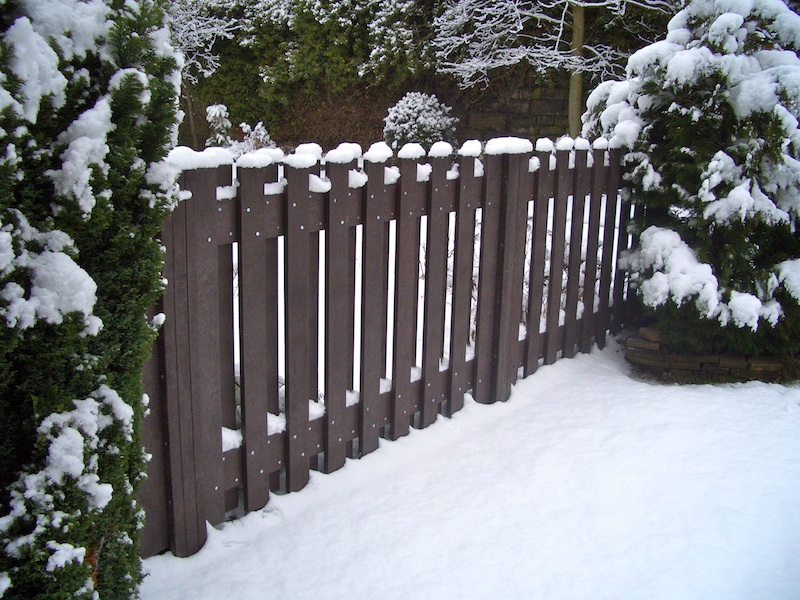Recycled plastic fence impervious to snow and ice